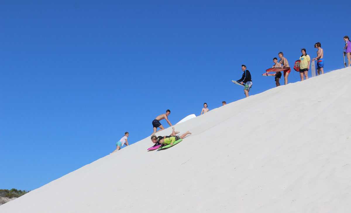 Sandboard and quad-bike on the Atlantis Dunes